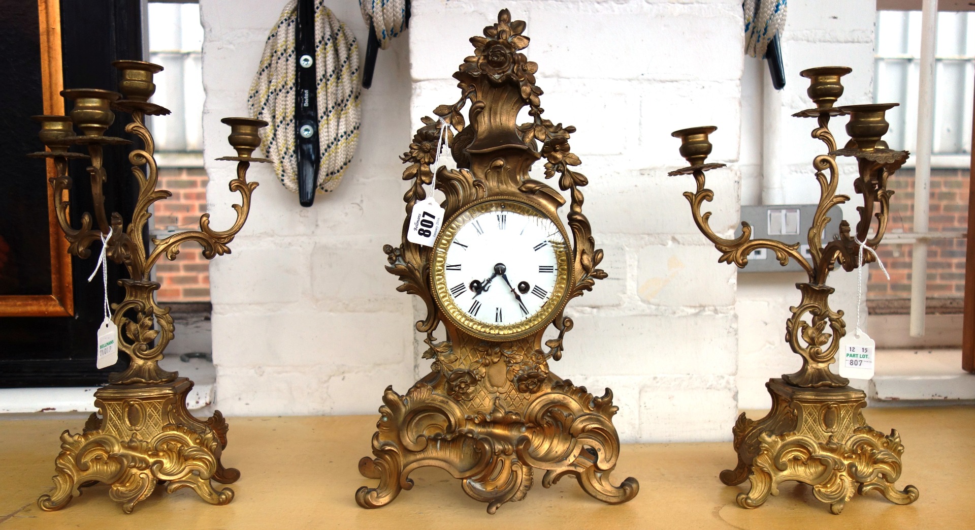 Appraisal: A gilt brass clock garniture early th century of th