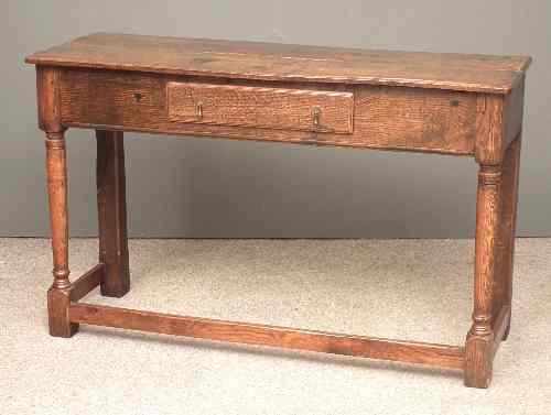 Appraisal: An old oak sidetable of '' th Century'' design with