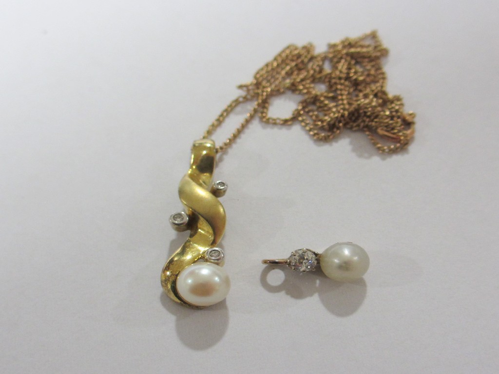 Appraisal: Two gold pearl and diamond set pendants one with gold