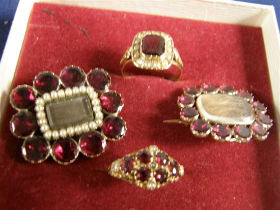 Appraisal: Two Victorian garnet set memorial brooches and two similar rings