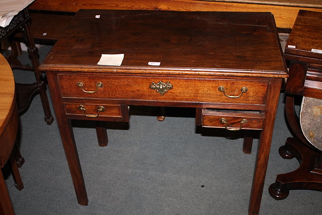 Appraisal: A GEORGIAN MAHOGANY LOWBOY with single low drawer over two