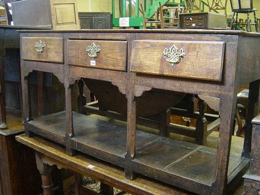 Appraisal: An th century oak Welsh dresser base fitted with three