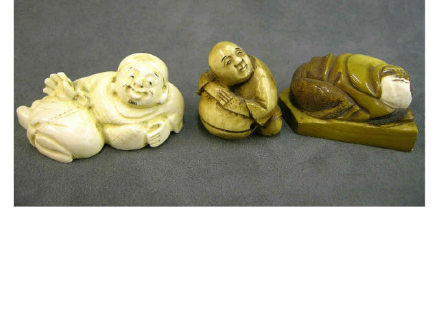 Appraisal: Three netsuke including ivory stained man sitting and leaning reclining