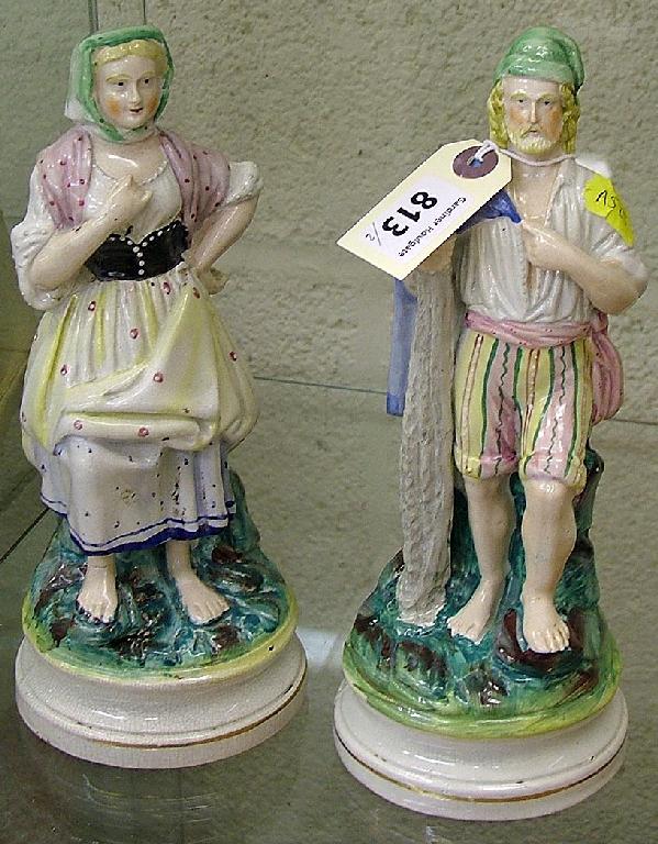 Appraisal: Pair of th century Staffordshire figurines depicting a fisherman and