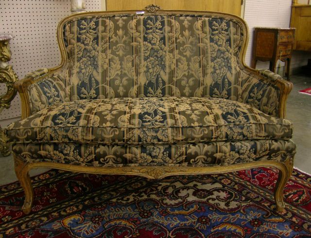 Appraisal: Country French love seat with floral carved decoration and distressed