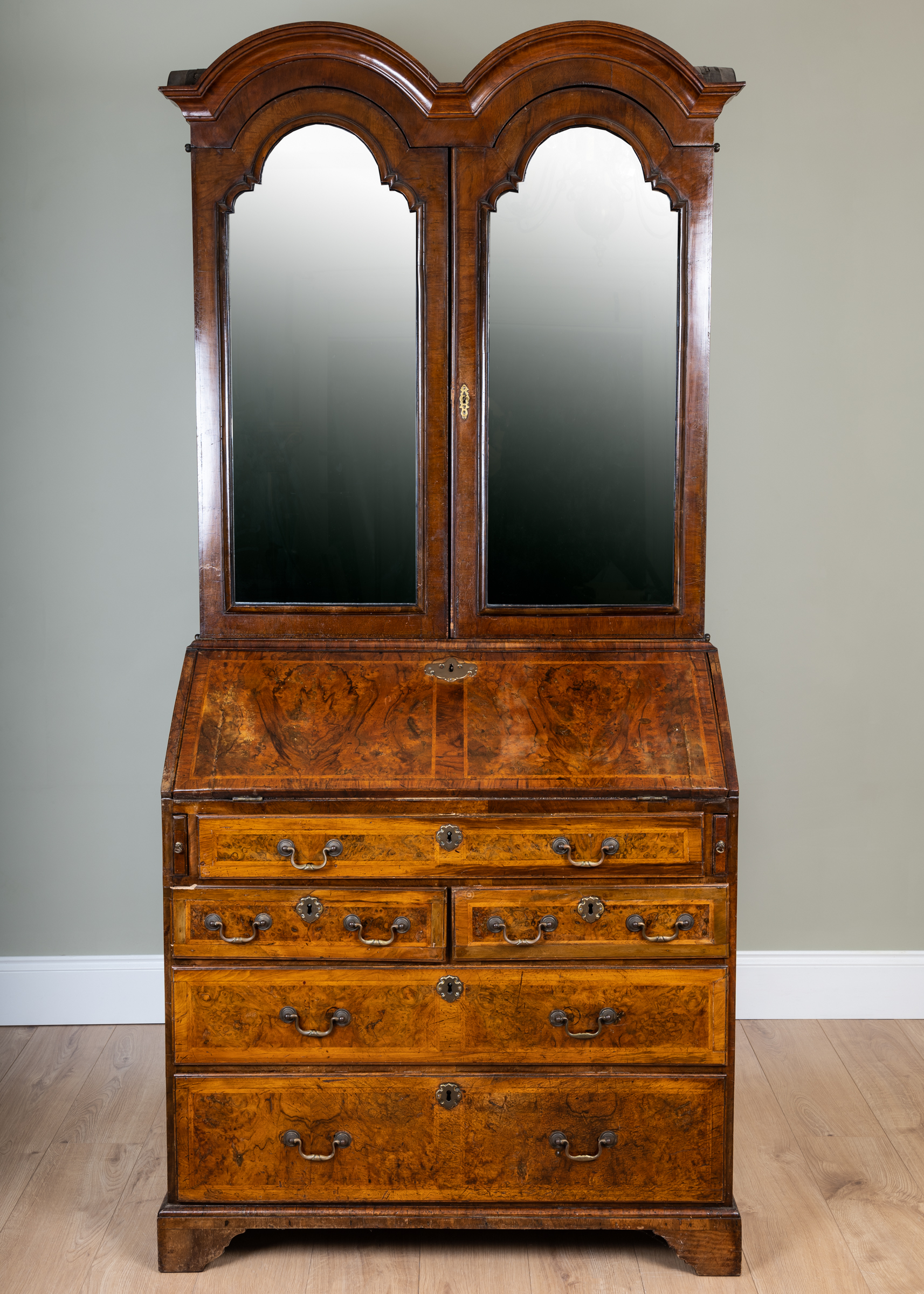 Appraisal: A George II and later walnut bureau bookcase the upper