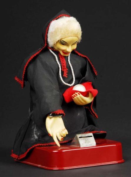 Appraisal: Tin Gypsy Fortune Teller Battery-Operated Toy Description Japanese Working Includes