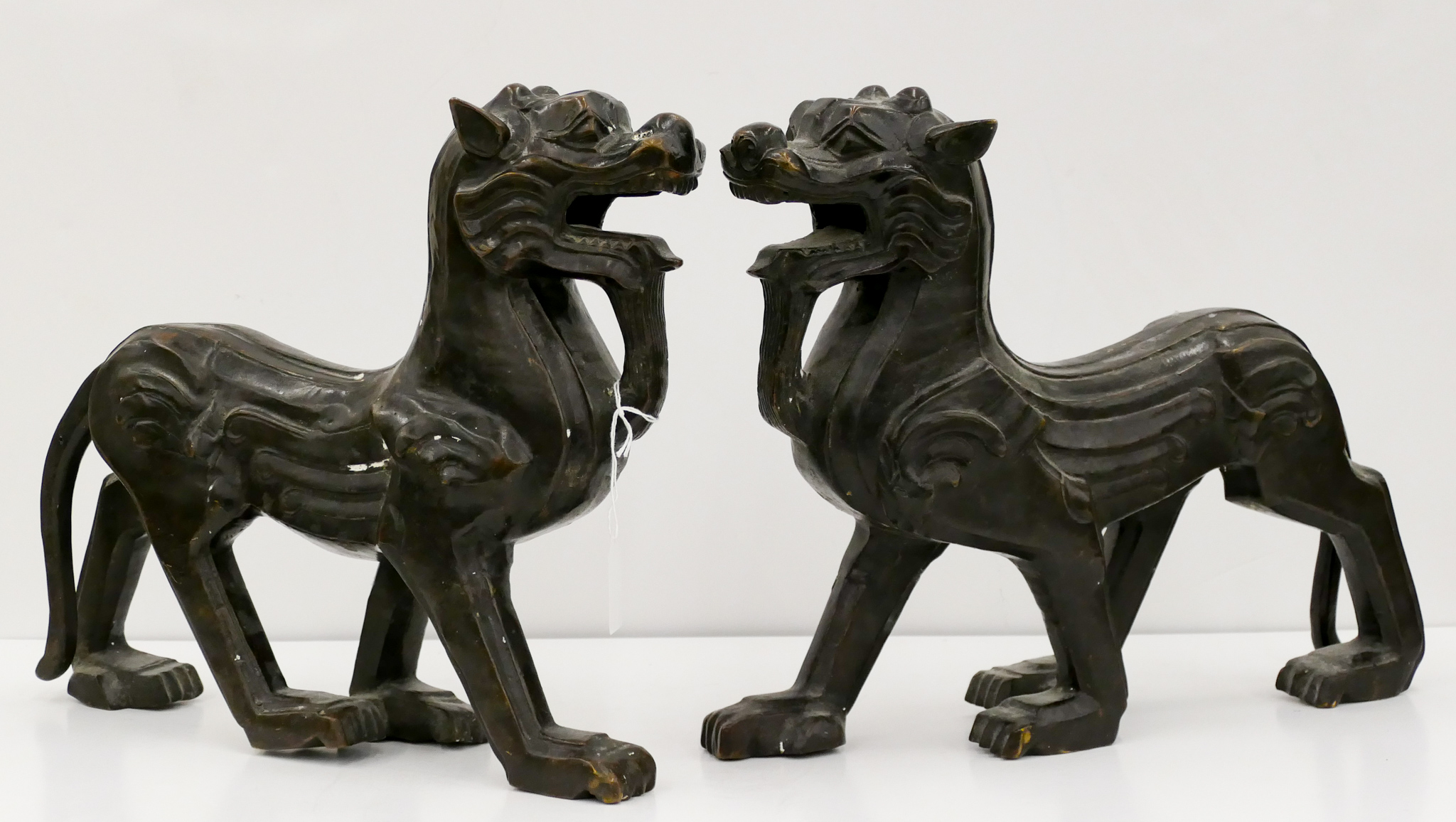 Appraisal: Pair Asian Style Art Deco Bronze Lion Sculptures ''x ''