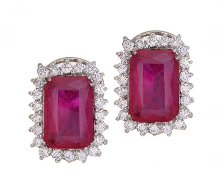 Appraisal: A PAIR OF RUBY AND WHITE SAPPHIRE CLUSTER EARRINGS each