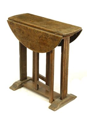 Appraisal: A small oak drop-leaf table in th century style in