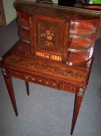 Appraisal: A late Regency inlaid rosewood bonheur-du-jour the superstructure with brass