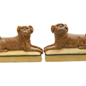 Appraisal: A Pair of Continental Ceramic Figures of Recumbent Pugs th