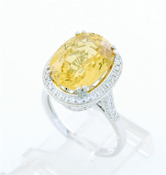 Appraisal: Yellow sapphire and diamond ring oval-cut sapphire ct and one