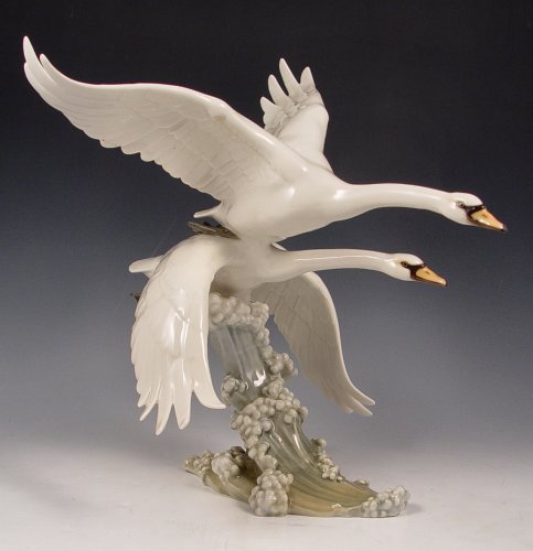 Appraisal: HUTSCHENREUTHER PORCELAIN SWANS IN FLIGHT Designed by Hans Achtziger ''h