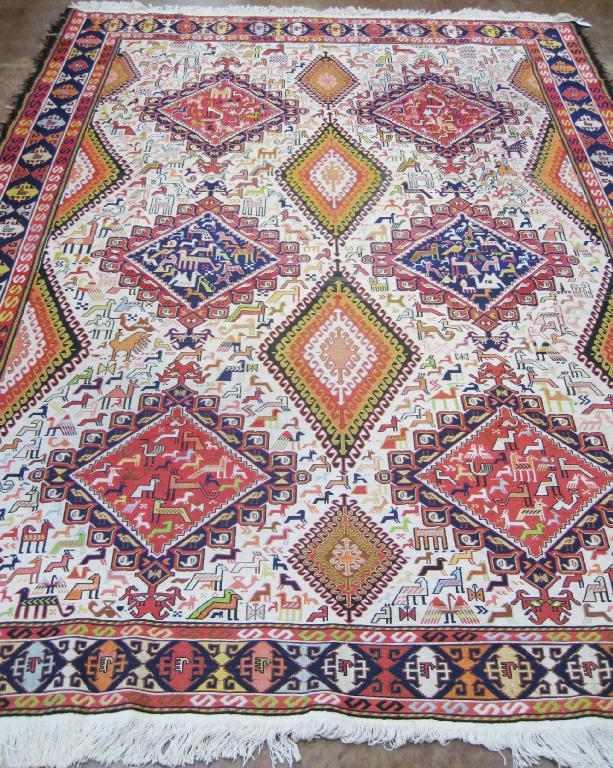 Appraisal: A Turkish silk Rug of multi bordered design decorated lozenge