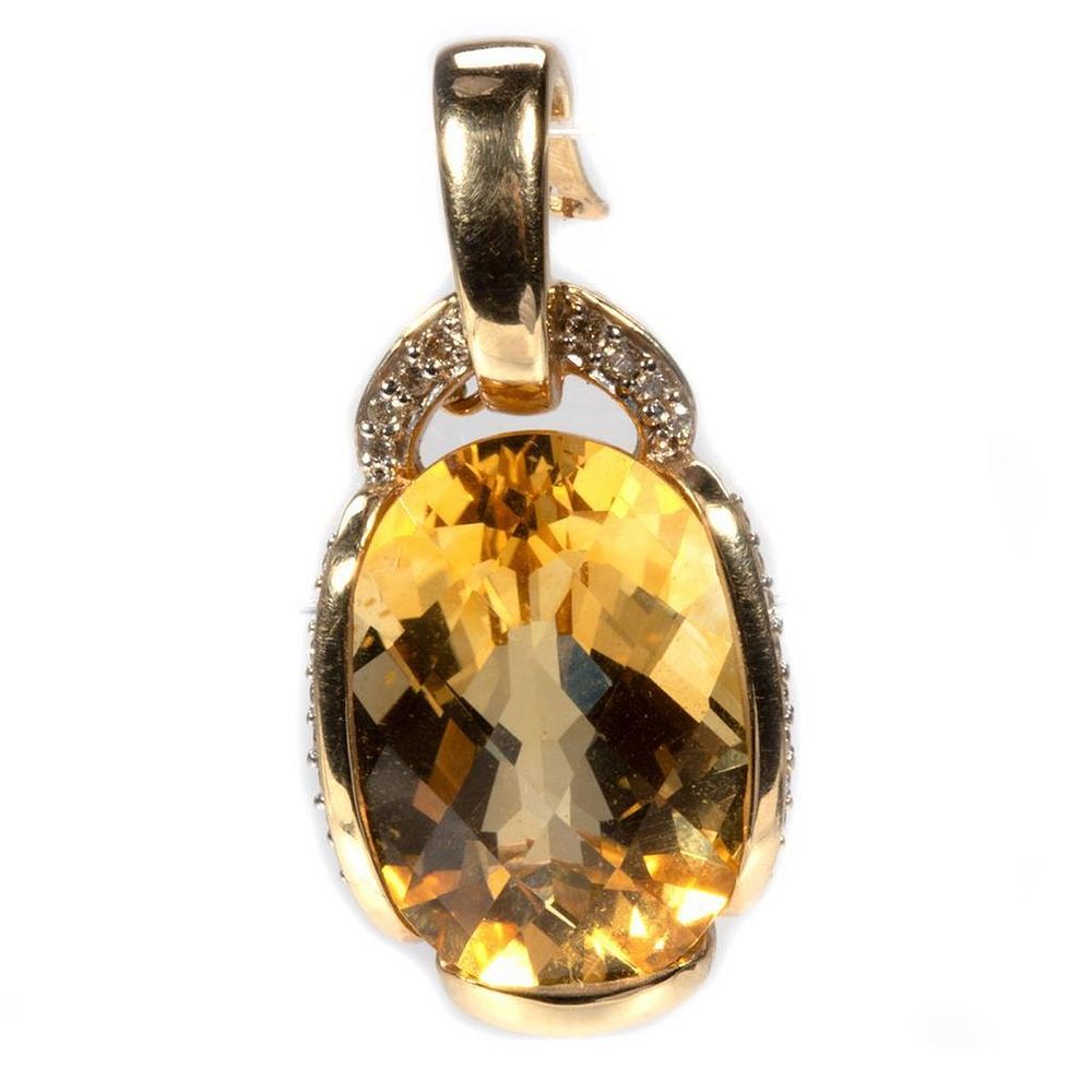 Appraisal: Citrine diamond and k gold pendant-enhancer centering an oval-shaped mixed