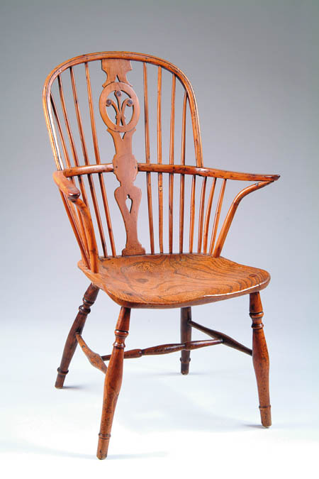 Appraisal: TH CENTURY ENGLISH WINDSOR ARMCHAIR The spindle back supporting a