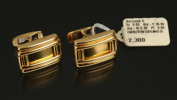 Appraisal: A heavy pair of cufflinks the rectangular fronts with stepped