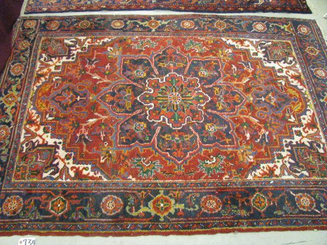 Appraisal: Heriz Persian Handmade Rug elaborate floral medallion red field '