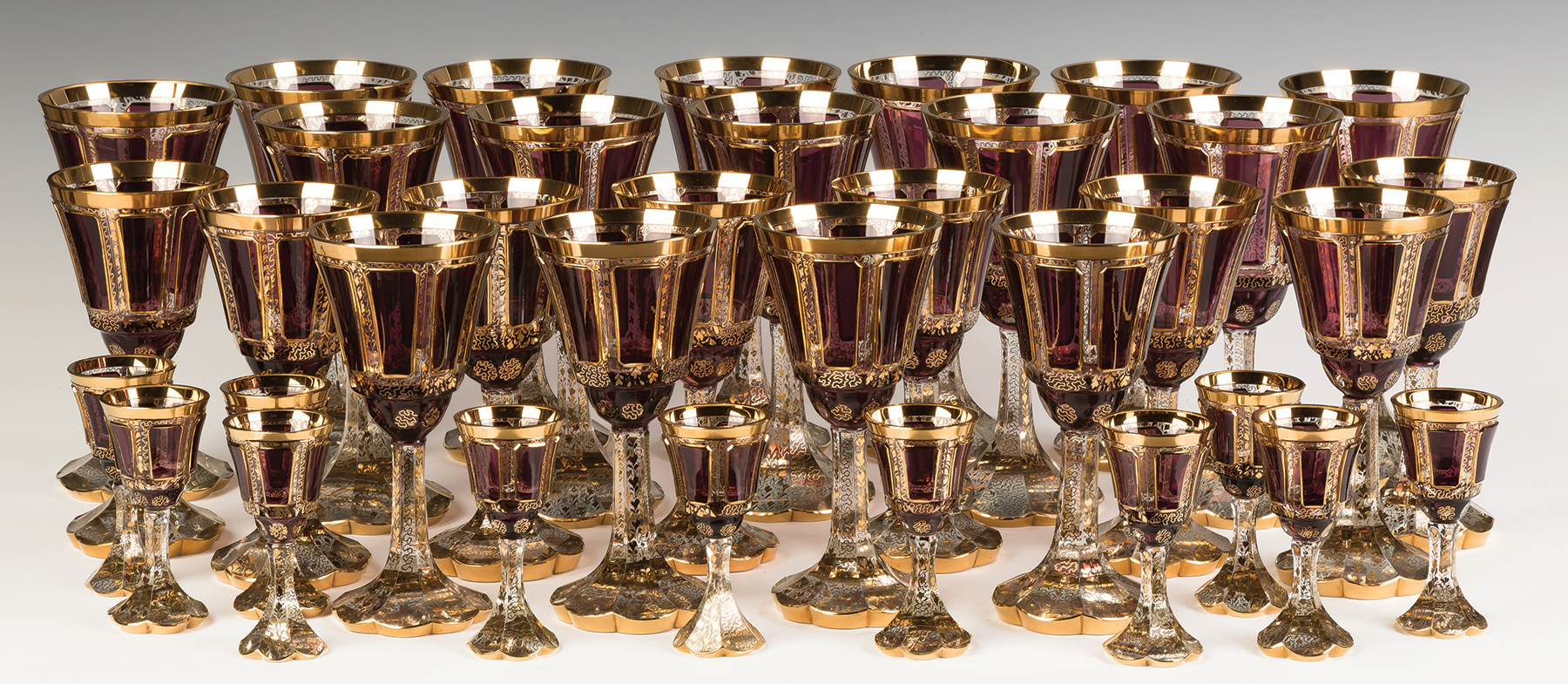 Appraisal: Bohemian Amethyst and Gold Leaf Stemware Late th century large