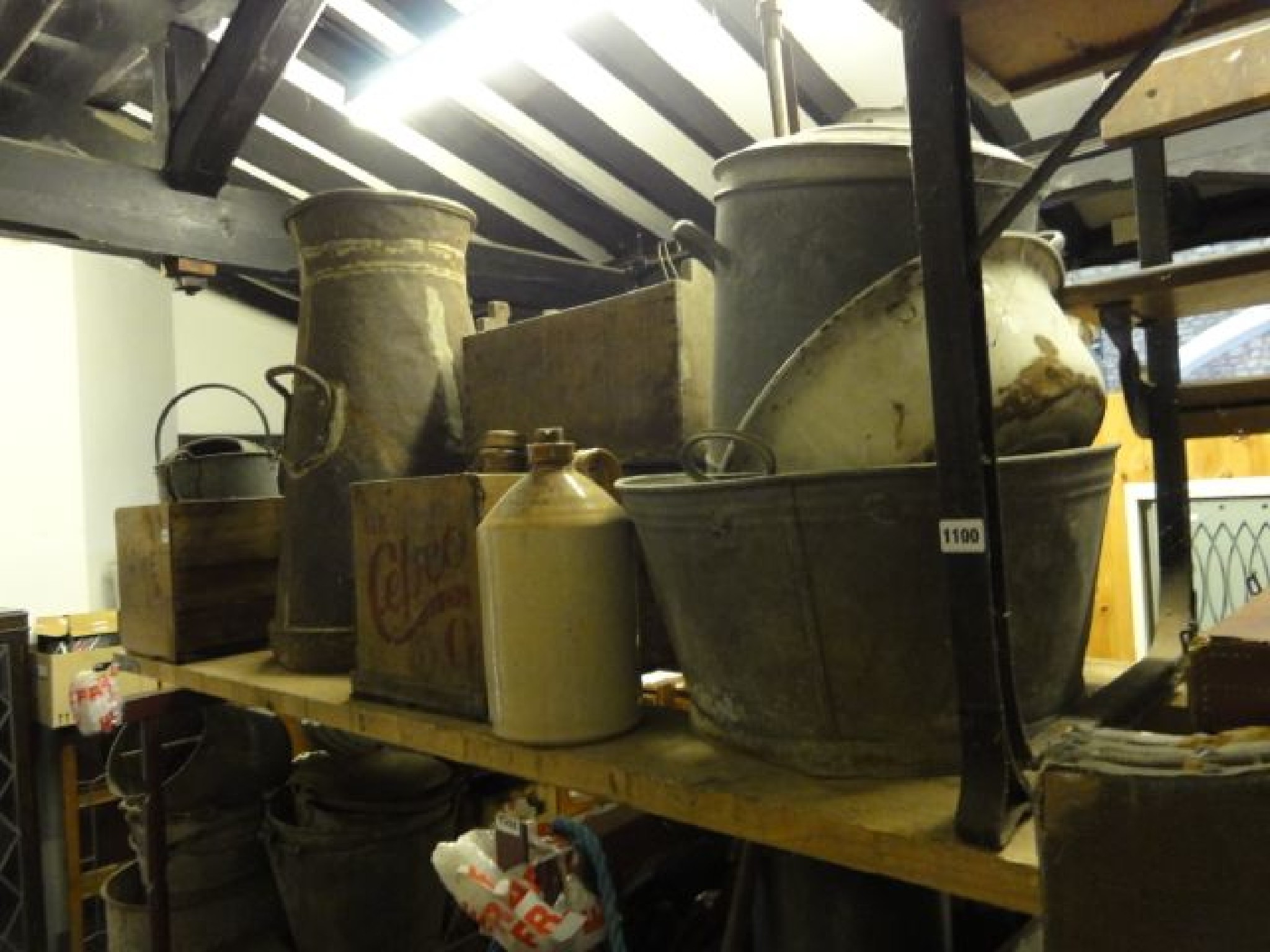 Appraisal: An old waisted cylindrical tapered milk churn together with a