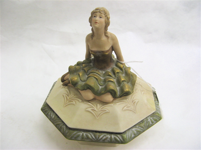 Appraisal: ROYAL DUX POTTERY COVERED DRESSER JAR c with figural handle