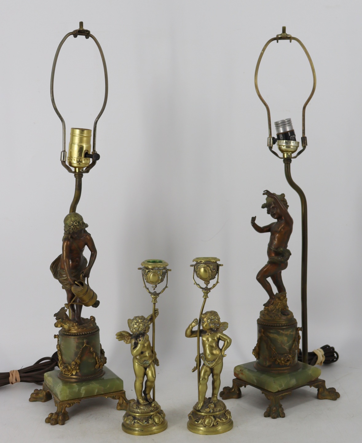 Appraisal: PAIR OF BRONZE CHERUB FORM LAMPS WITH CANDLESTICKS Pair of