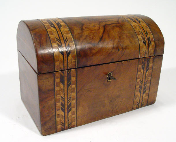 Appraisal: Victorian walnut dome topped twin divisional tea caddy with lids