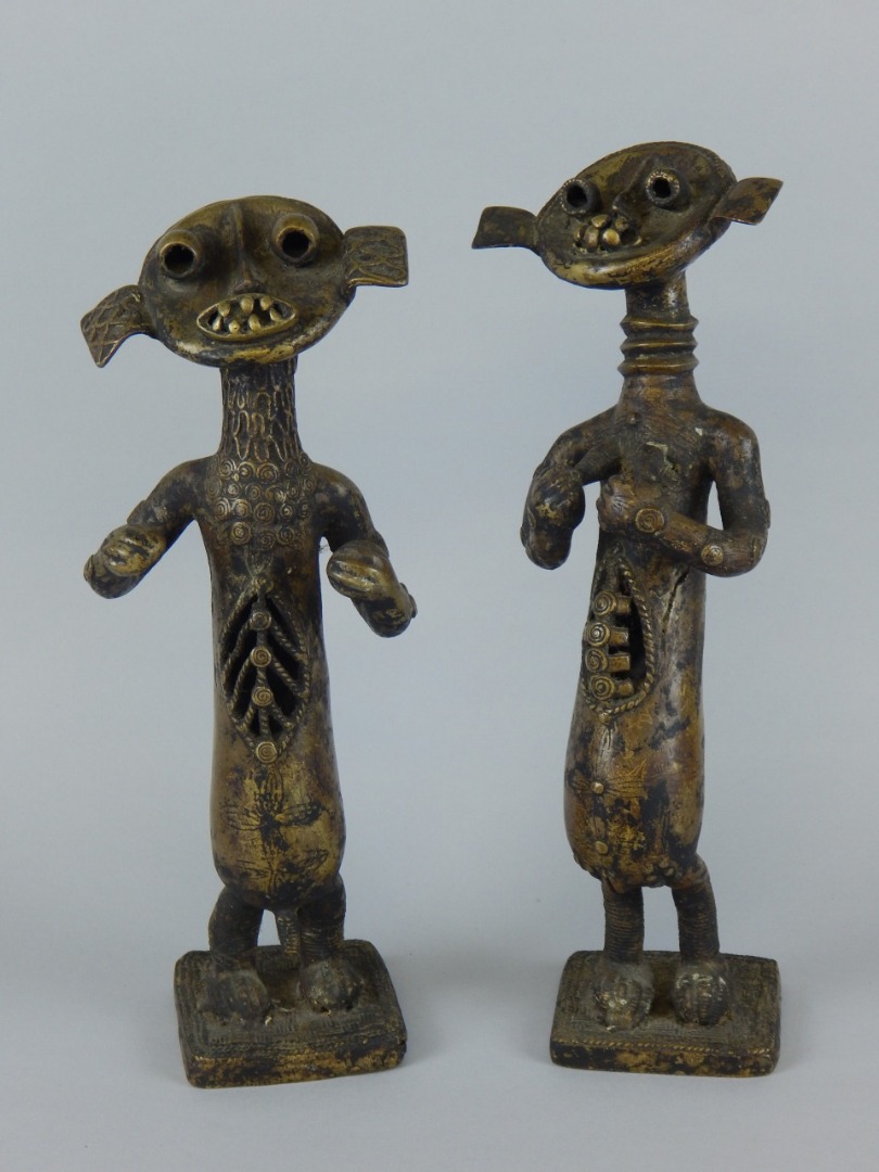 Appraisal: Tribal Art A pair of African male and female bronze