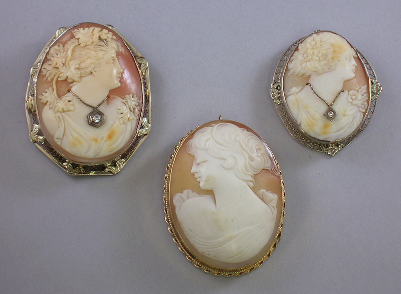 Appraisal: Three Gold-framed Shell-carved Cameos two with diamond accents