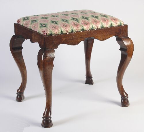 Appraisal: A stained wood and upholstered stool of William and Mary