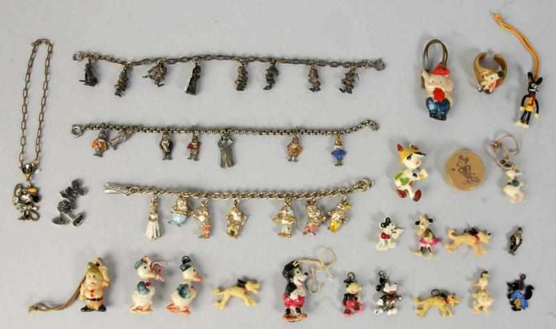 Appraisal: Lot of Celluloid Disney Character Charms Description Includes Pinocchio Donald