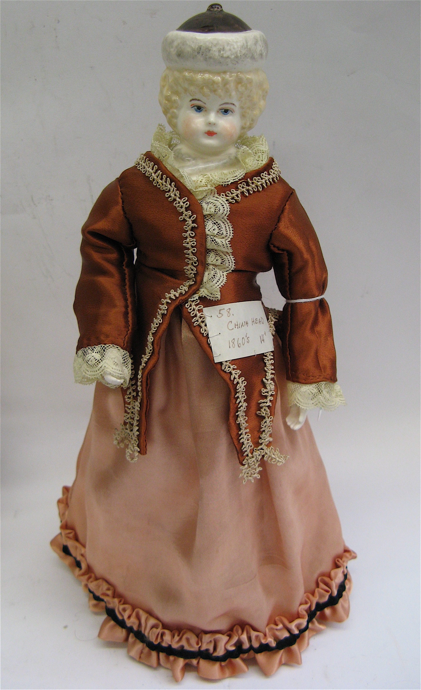 Appraisal: GERMAN CHINA HEAD DOLL in C Blond molded hair painted