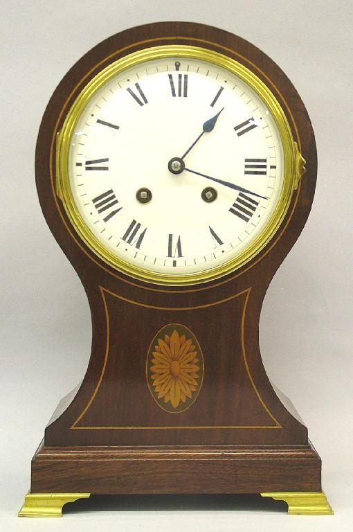 Appraisal: French mahogany two train balloon mantel clock the movement with