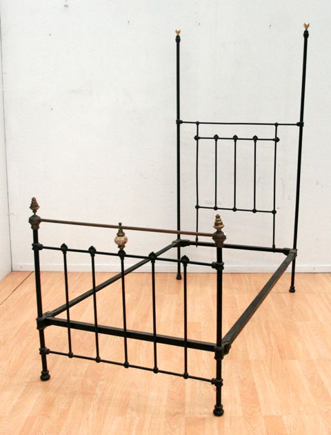 Appraisal: A cast iron and brass single bed with floral painted