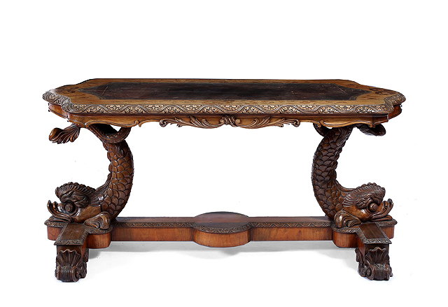 Appraisal: A TH CENTURY CARVED WALNUT SHAPED CENTRE TABLE with a