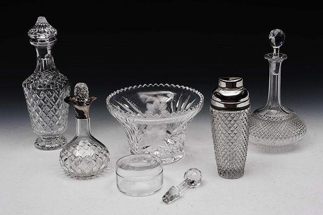 Appraisal: THREE CUT GLASS DECANTERS AND STOPPERS a hobnail cut cocktail