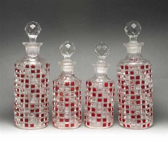 Appraisal: Two pairs of Bohemian cranberry stained colorless glass decanters early