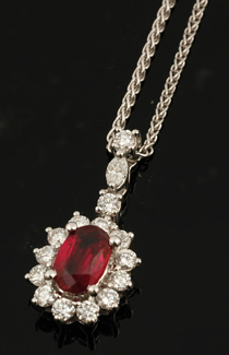 Appraisal: RUBY AND DIAMOND CLUSTER PENDANT TO A DIAMOND SET BALE