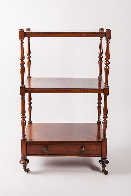 Appraisal: AN EARLY VICTORIAN MAHOGANY THREE TIER WHATNOT with turned supports