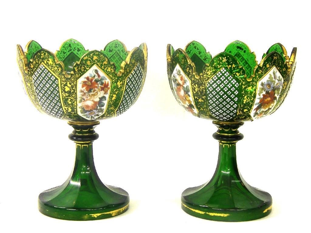 Appraisal: Pair of Victorian green overlaid glass pedestal bowls the wavy