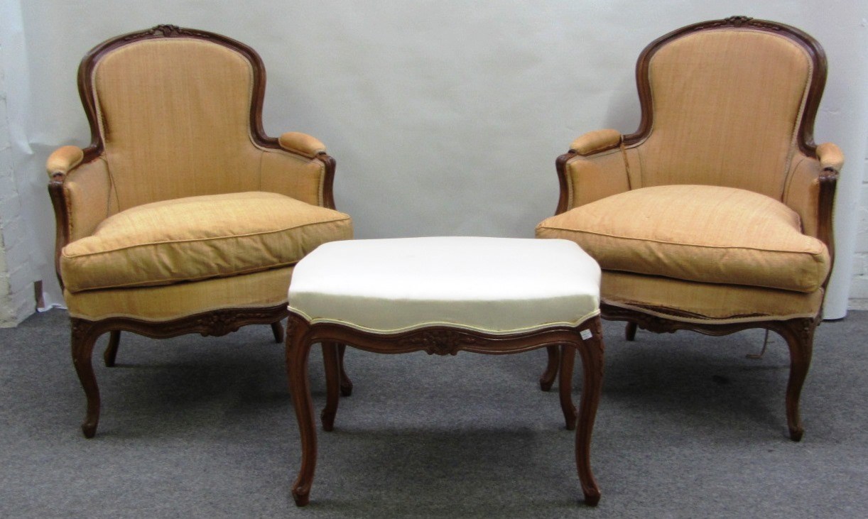 Appraisal: A pair of Louis XV style stained beech fauteuils each