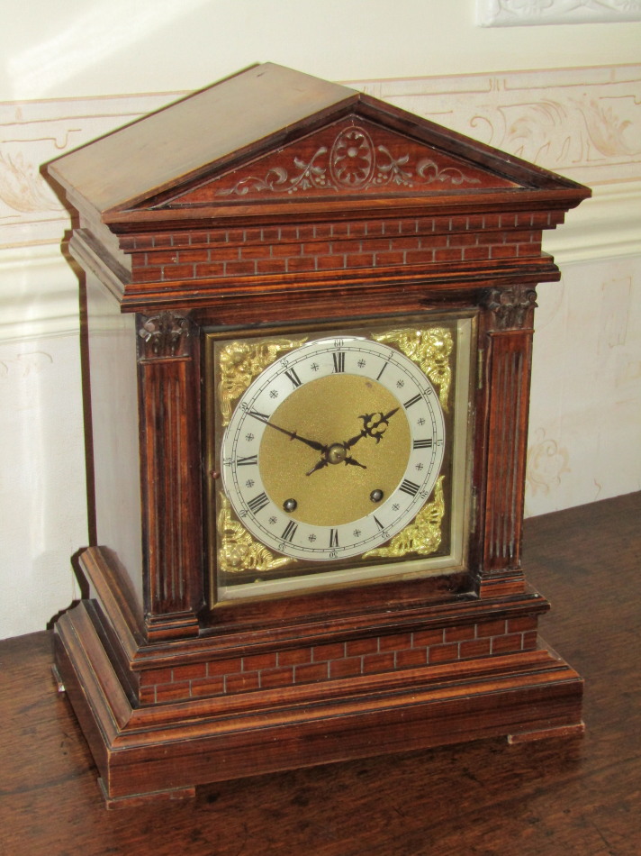 Appraisal: An Edwardian oak cased architectural bracket clock of Palladian design