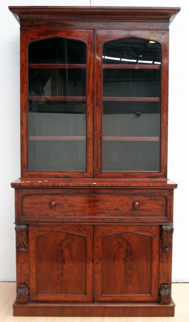 Appraisal: An early Victorian fiddleback and flamed mahogany secretaire bookcase stamped