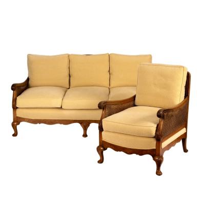 Appraisal: A berg re three-seater maple sofa and matching chair both