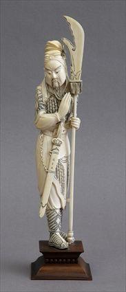 Appraisal: CHINESE CARVED IVORY FIGURE OF A GUARD Standing wearing mail