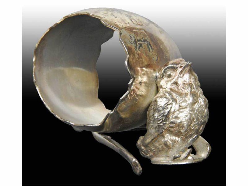 Appraisal: Chick Wishbone Figural Napkin Ring Description Shape of cracked egg