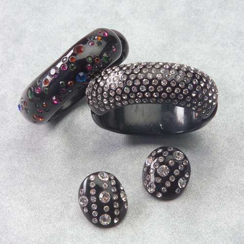 Appraisal: Four sparkler items with rhinestones Weiss hinged black cuff with