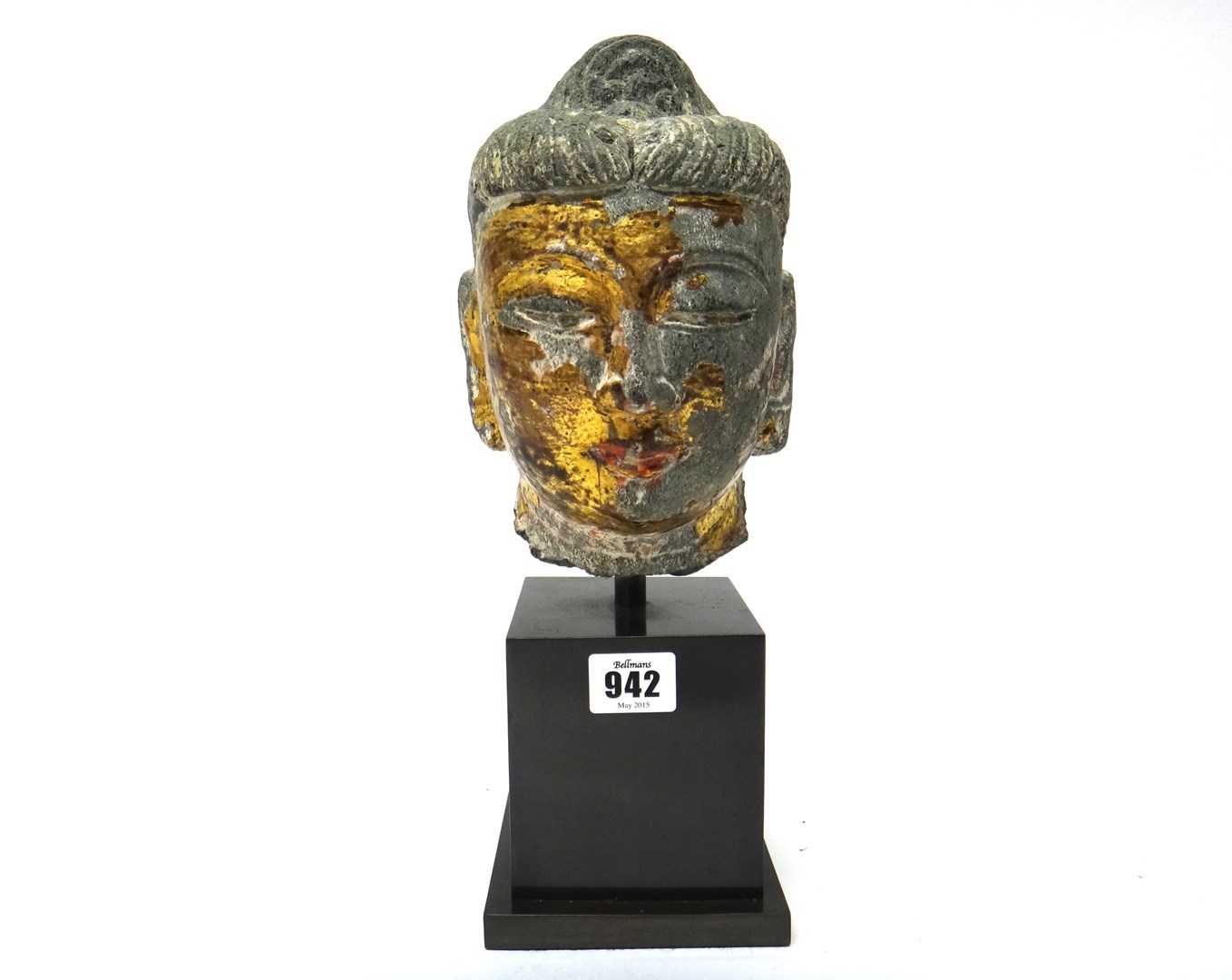 Appraisal: A Chinese gilt and painted stone head of buddha probably