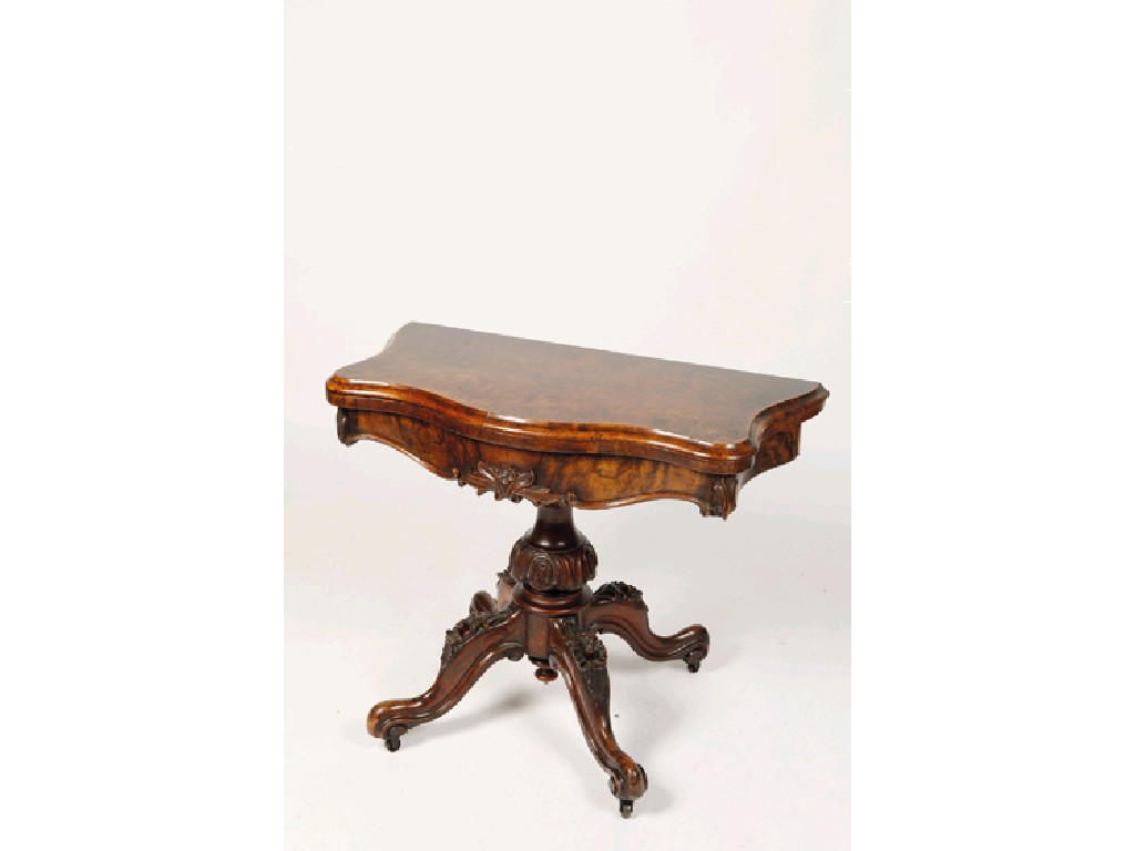 Appraisal: A VICTORIAN WALNUT VENEERED CARD TABLE the serpentine fronted top